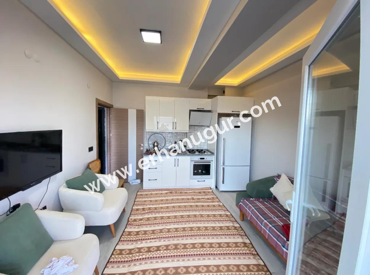 Gümüldür De Full Eşyalı Full Deniz Asansörlüdür Satılık 1+1 Daire